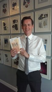 Photo of Scott Colvin holding his award-winning book Image © Jamie Veitch